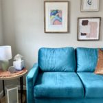 Image of a blue couch in a comfortable therapy room at our office.