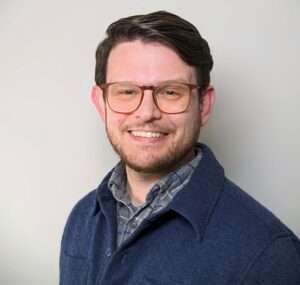 Professional headshot of counselor, Adam Robbins.